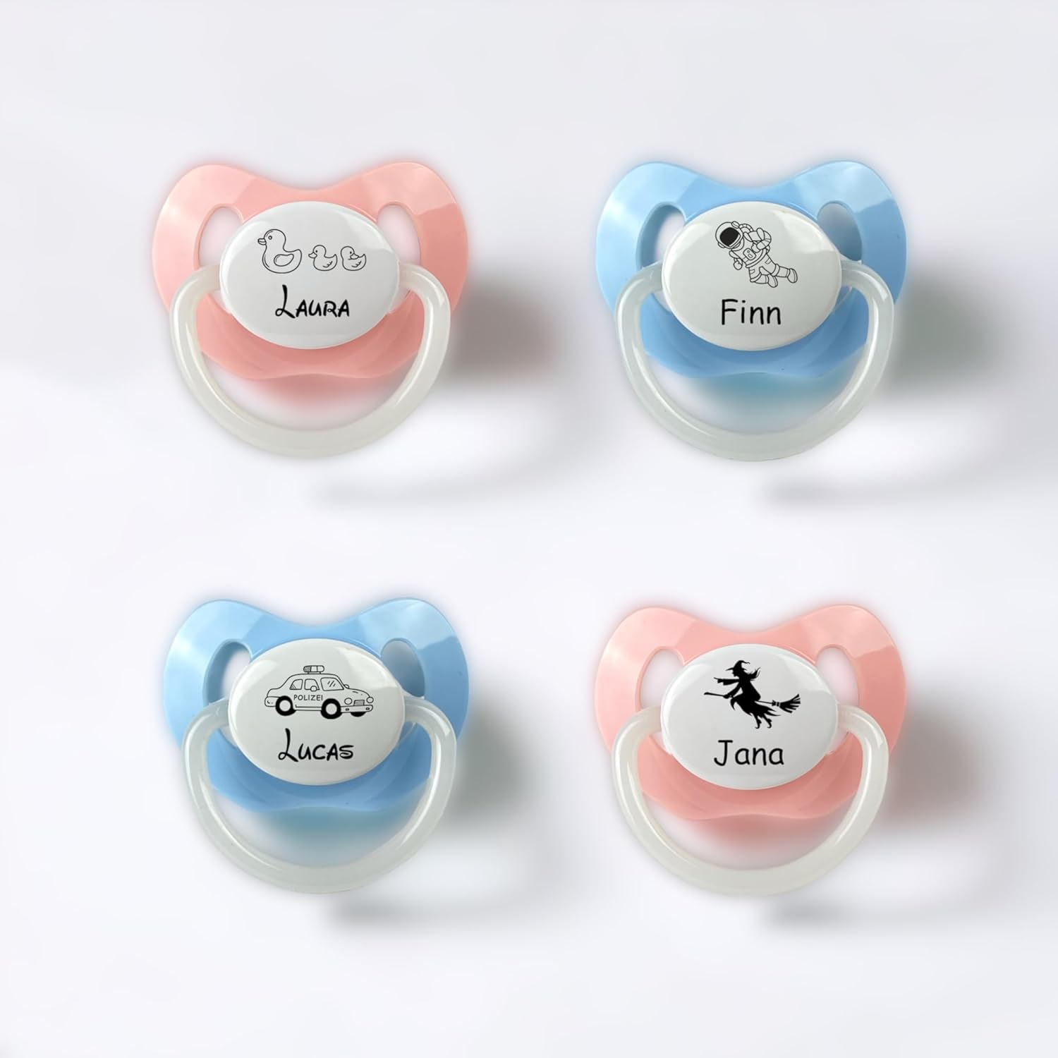 Schnuller in rosa und blau mit Gravur