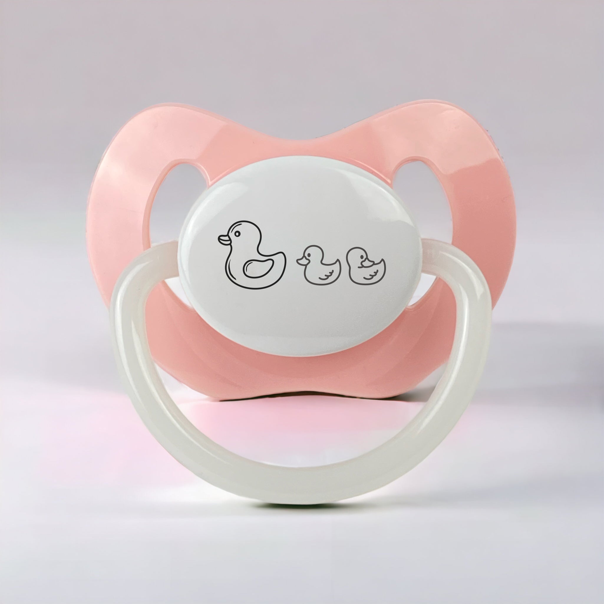 Schnuller in rosa mit Enten gravur